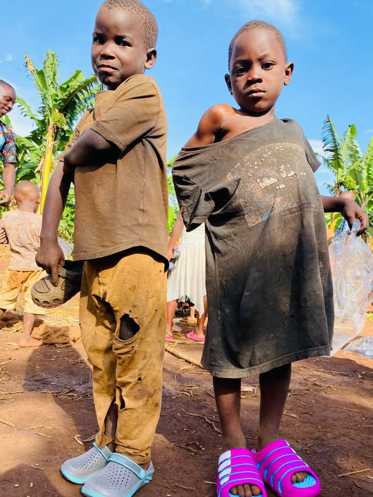Children receiving school supplies and hygiene kits with dignity
